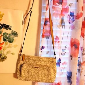 A leather beige and white medium Calvin Kline crossbody bag for $29.